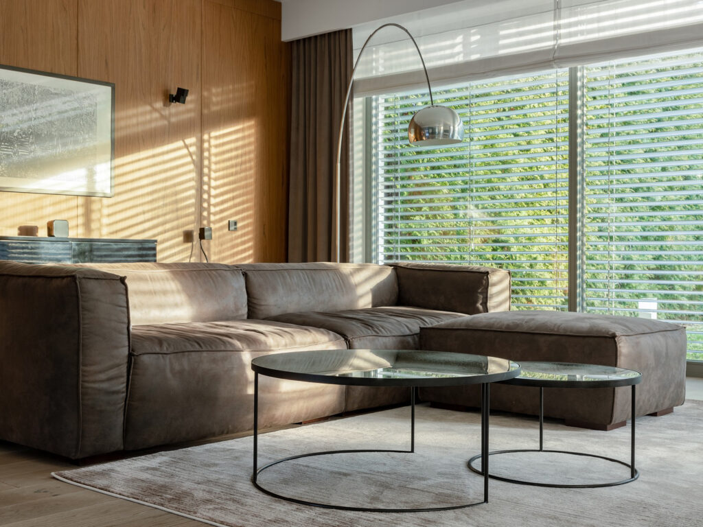 Living room with floor to ceiling windows with blinds